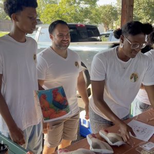 Members of the Chaidez family work their booth at the Athens Farmers Market.